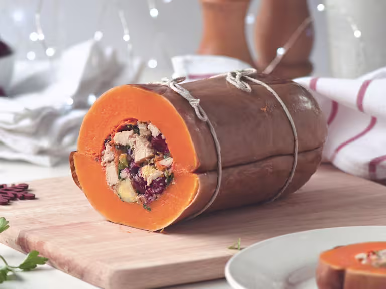 A butternut squash that has been stuffed with red onion, Brussels sprouts, cranberries, quinoa, and Quorn Vegan Pieces.