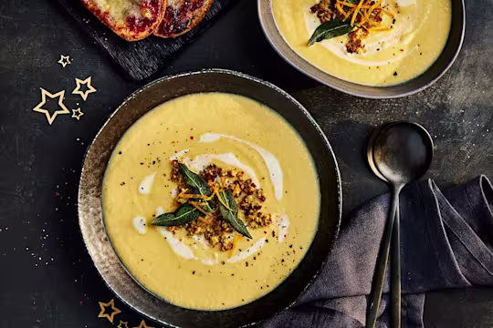 Quorn Christmas Soup with stuffing crumble and sage leaves on top