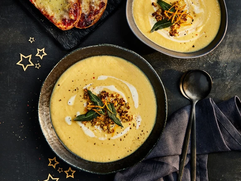 Quorn Christmas Soup with stuffing crumble and sage leaves on top