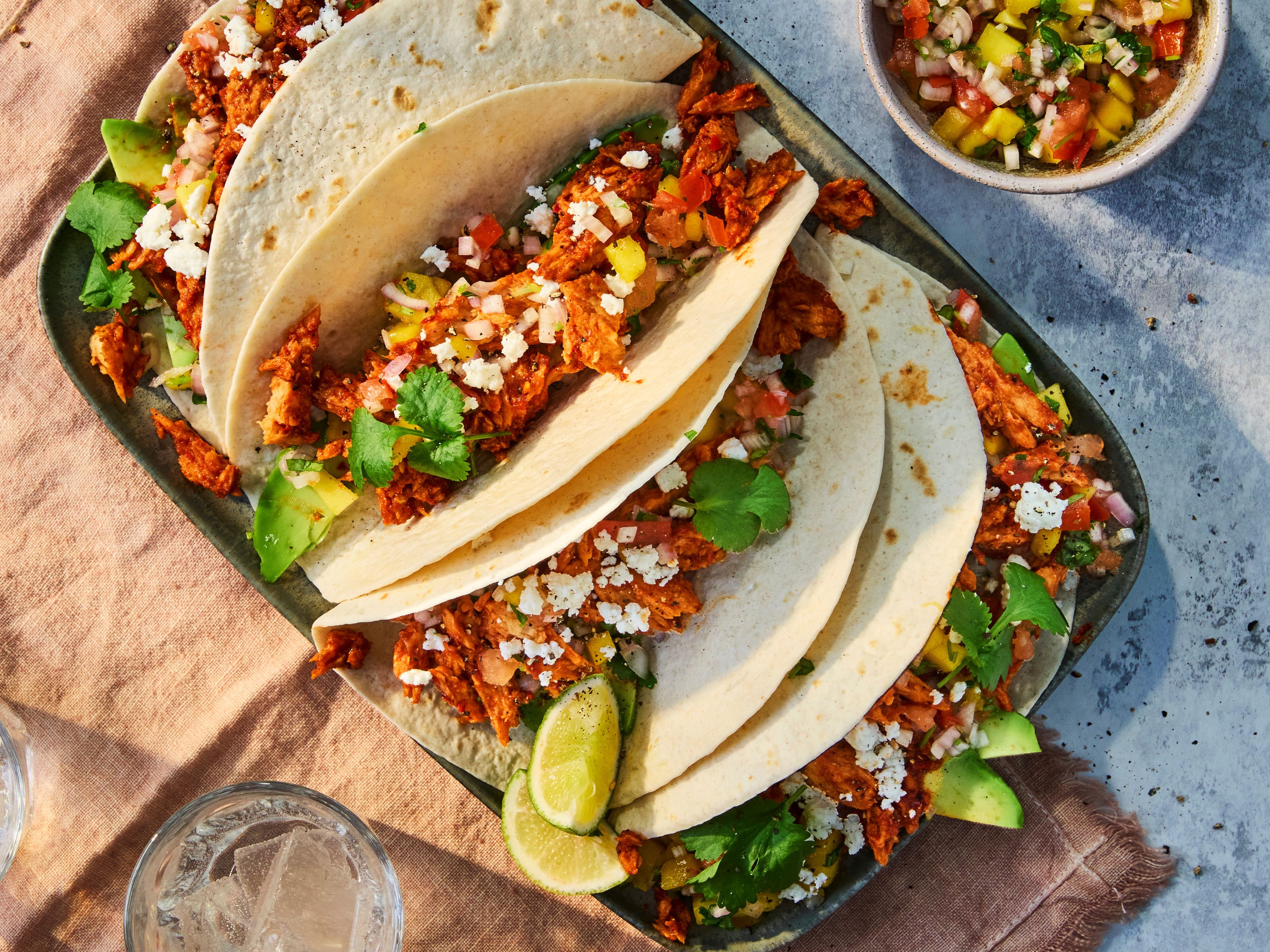 Chicken tinga tacos with Quorn Fillets, served with salsa, avocado, feta and coriander