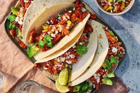 Chicken tinga tacos with Quorn Fillets, served with salsa, avocado, feta and coriander