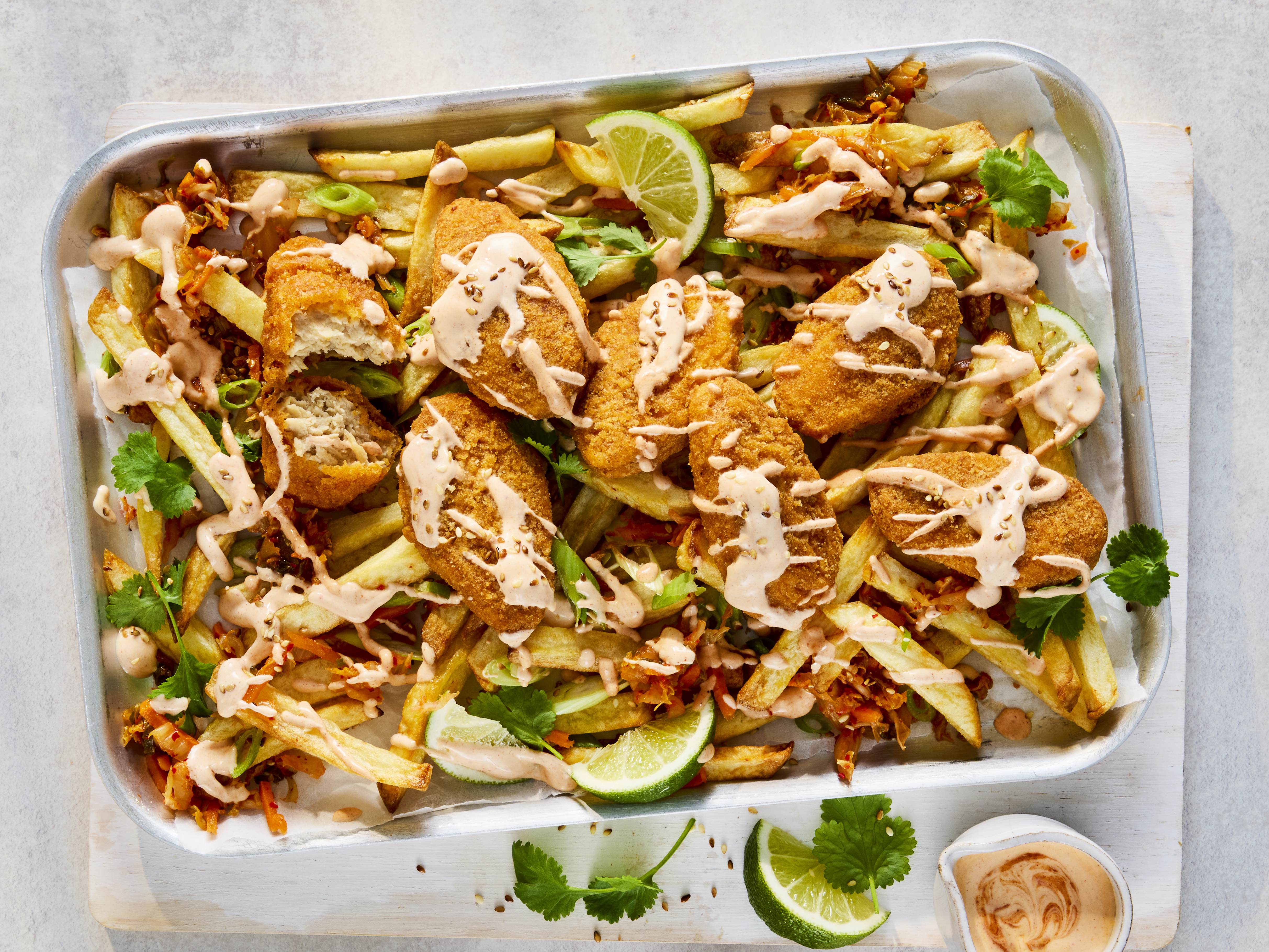 Loaded fries topped with Quorn Hot & Spicy Bites, kimchi and gochujang yoghurt sauce.