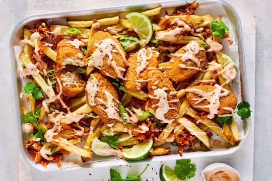 Loaded fries topped with Quorn Hot & Spicy Bites, kimchi and gochujang yoghurt sauce.