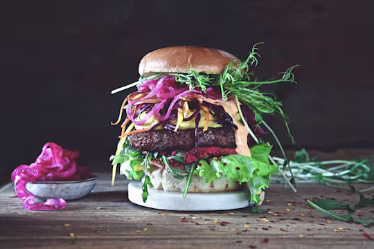 Burger recipe made with a Quorn Quarter Pounder layered with lettuce, beetroot, salad, pickled red onion and beansprouts