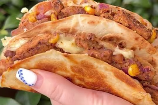 Quorn Vegetarian Steak Strips with red onion and sweetcorn in a quesadilla.