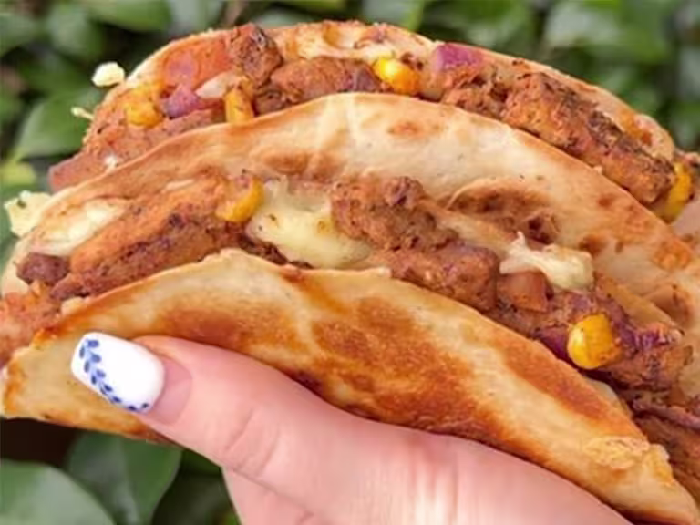 Quorn Vegetarian Steak Strips with red onion and sweetcorn in a quesadilla.