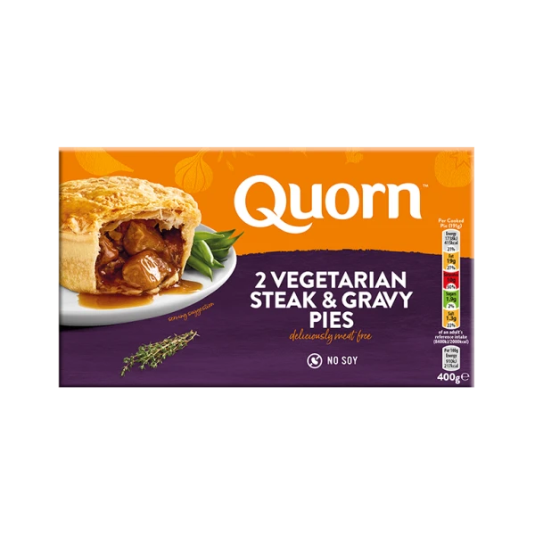 A box of Quorn Steak & Gravy Pies showing the prepared product and information on an orange and charcoal background.