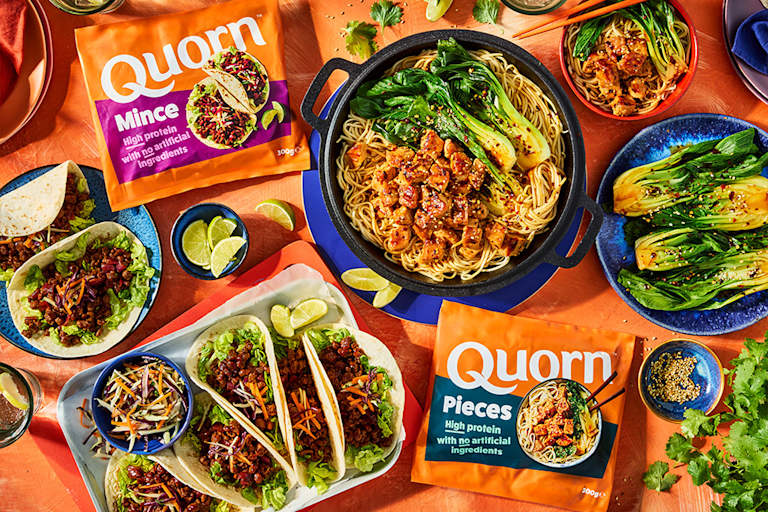 High protein Quorn Mince and Pieces on a table with recipes featuring the products