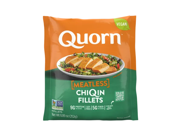 A bag of Quorn Meatless Vegan Fillets showing the plated product and information on an orange and charcoal background.