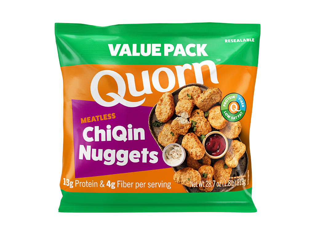 A box of Quorn Meatless Nuggets showing the plates product and information on an orange and charcoal background.