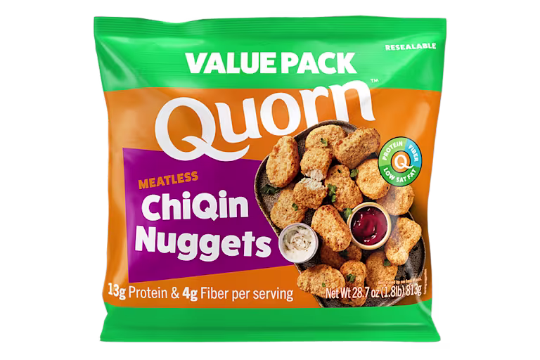 A box of Quorn Meatless Nuggets showing the plates product and information on an orange and charcoal background.