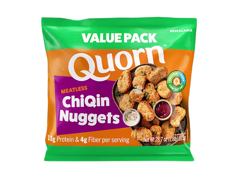 A box of Quorn Meatless Nuggets showing the plates product and information on an orange and charcoal background.