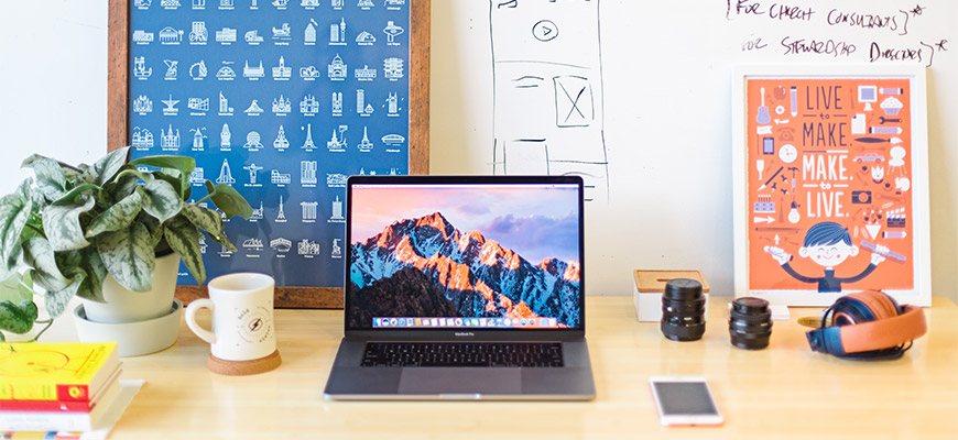 Computer and creative-looking desk area.