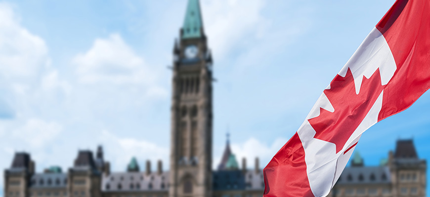 Canadian flag with parliament buildings
