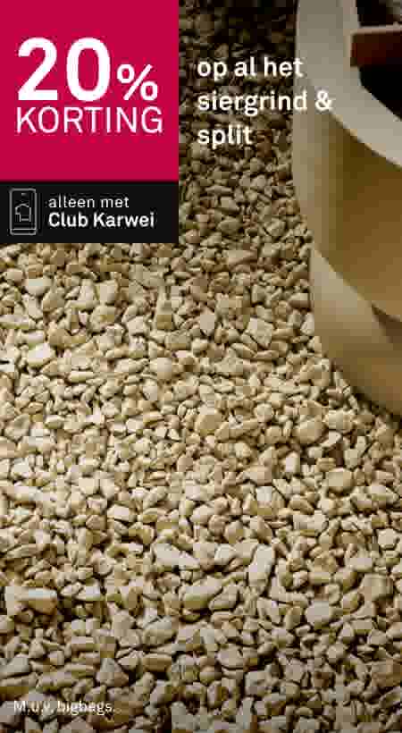 20% korting op siergrind en split met Club Karwei, beige grindstenen met decoratieve pot op de achtergrond