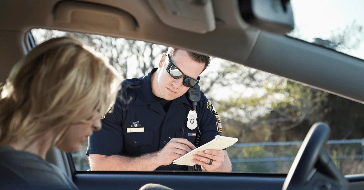 Woman getting a fine for speeding Woman getting a fine for speeding