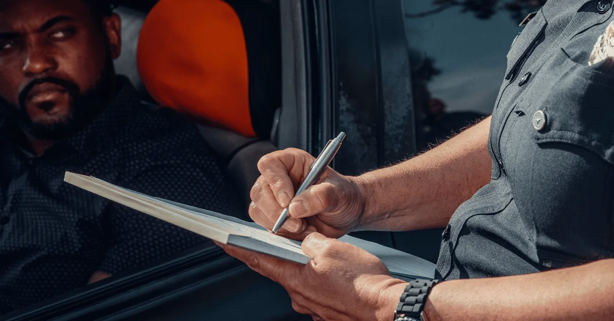 Fine being written by a traffic officer Fine being written by a traffic officer