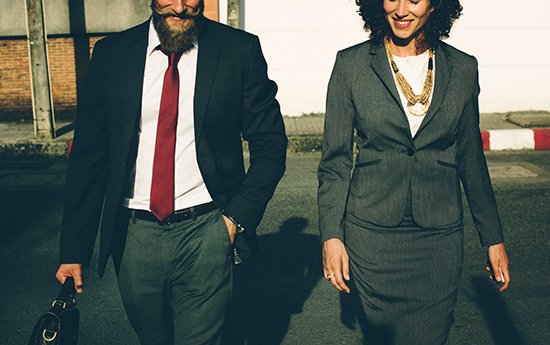 An image of a man and woman in professional attire