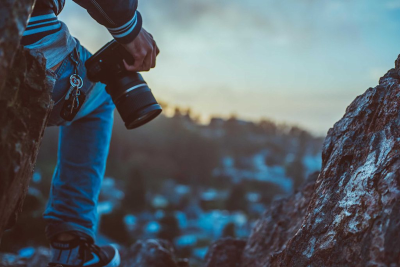 A picture of a man's hand with his camera