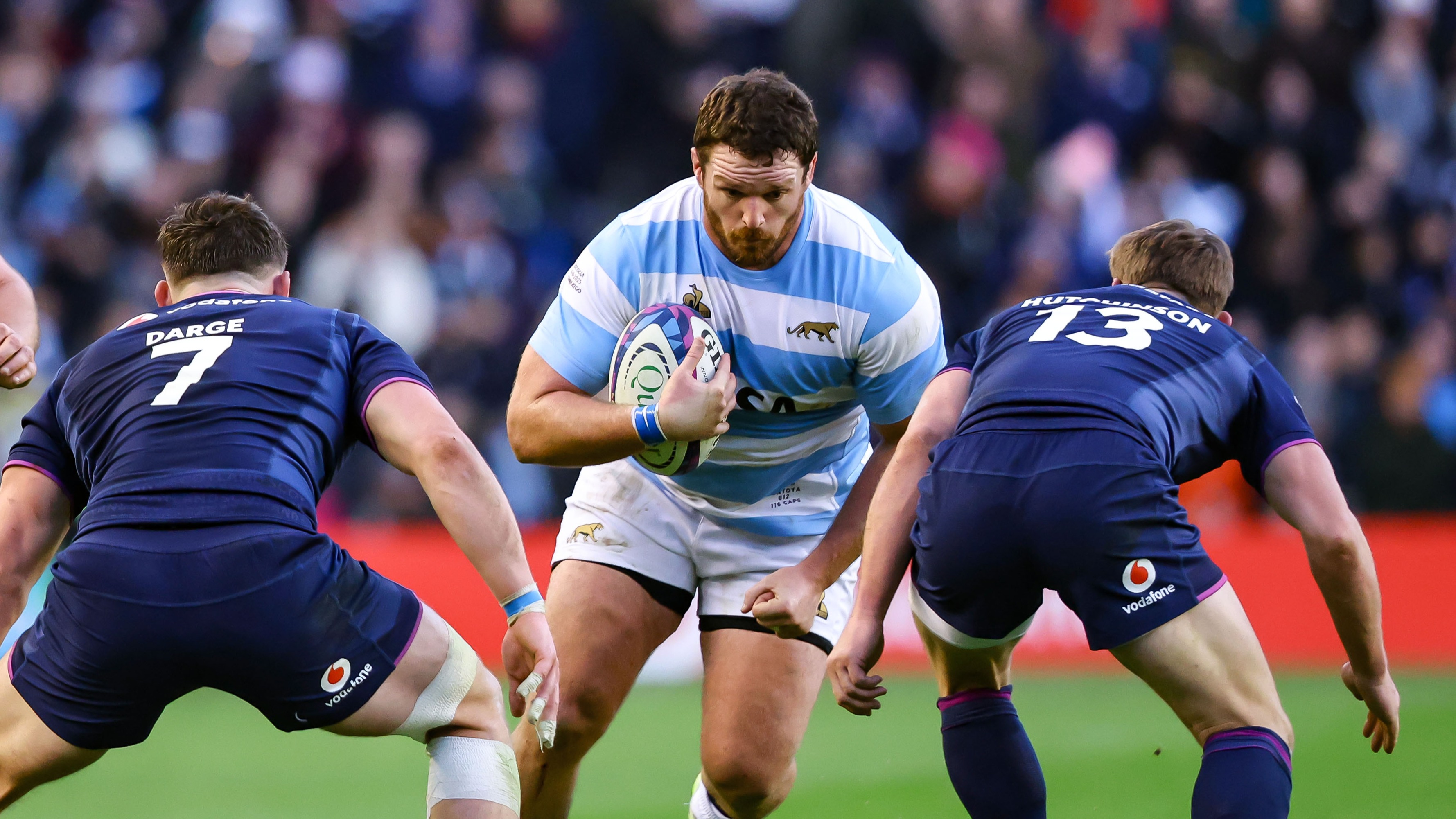 Argentina's Julián Montoya braces himself for a tackle by Scotland’s Rory Darge and Rory Hutchinson during the 2025 Quilter Nations Series.