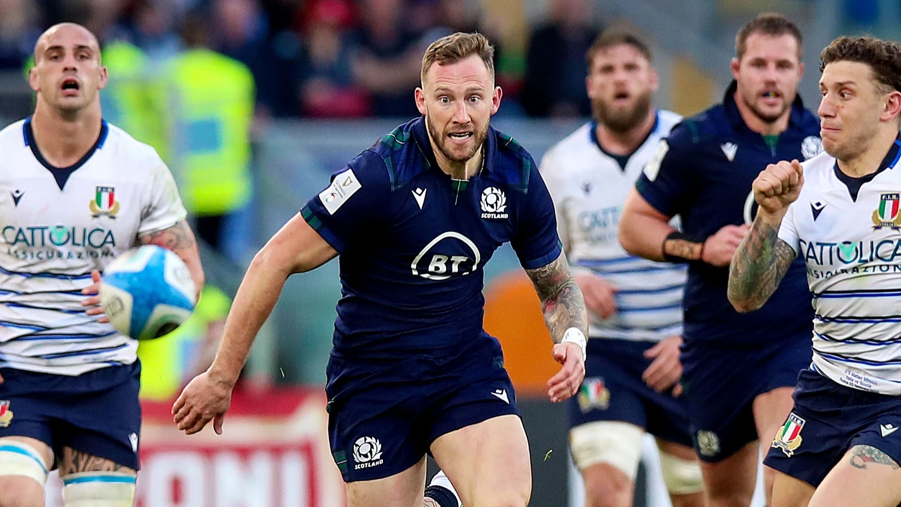 Scotland's Byron McGuigan chases the ball against Italy during the 2020 Guinness Men's Six Nations.