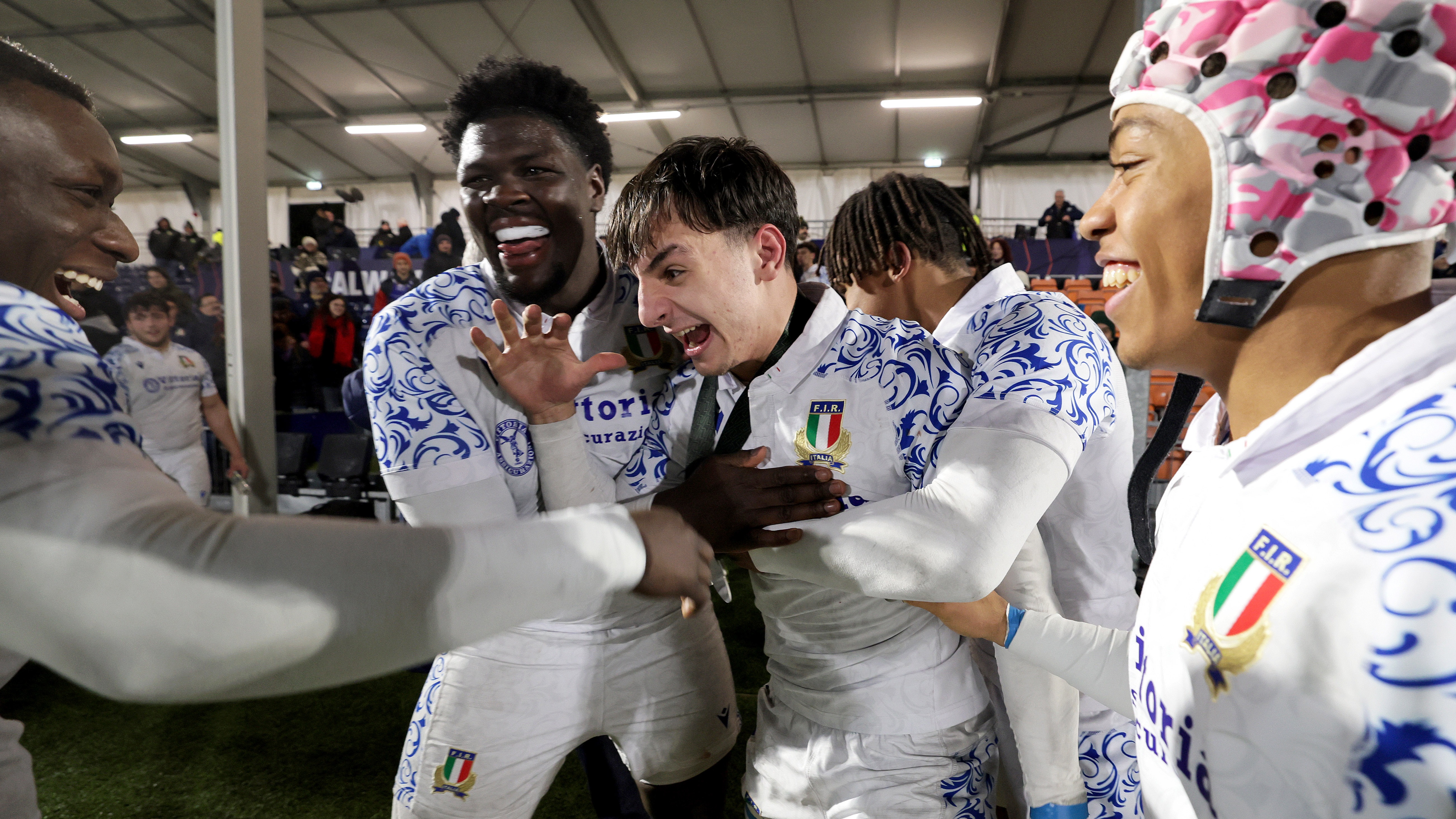 taly's Nelson Casartelli, Enoch Opoku Gyamfi, Edoardo Todaro and Giacomo Ndoumbe celebrate after beating Scotland in the 2025 Under 20 Six Nations 