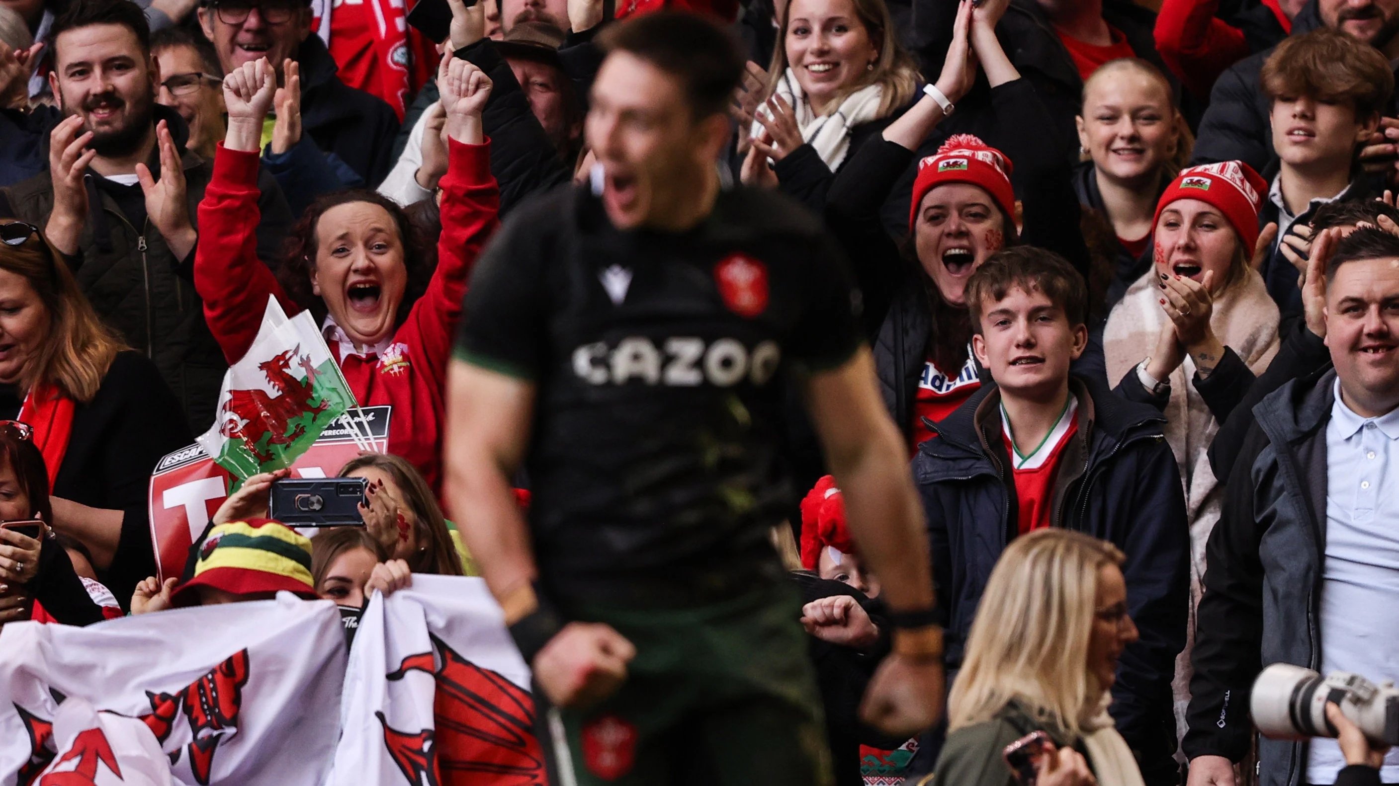 Wales fans celebrate after Josh Adams runs in to score a try against Georgia in the 2022 Autumn Nations Series.