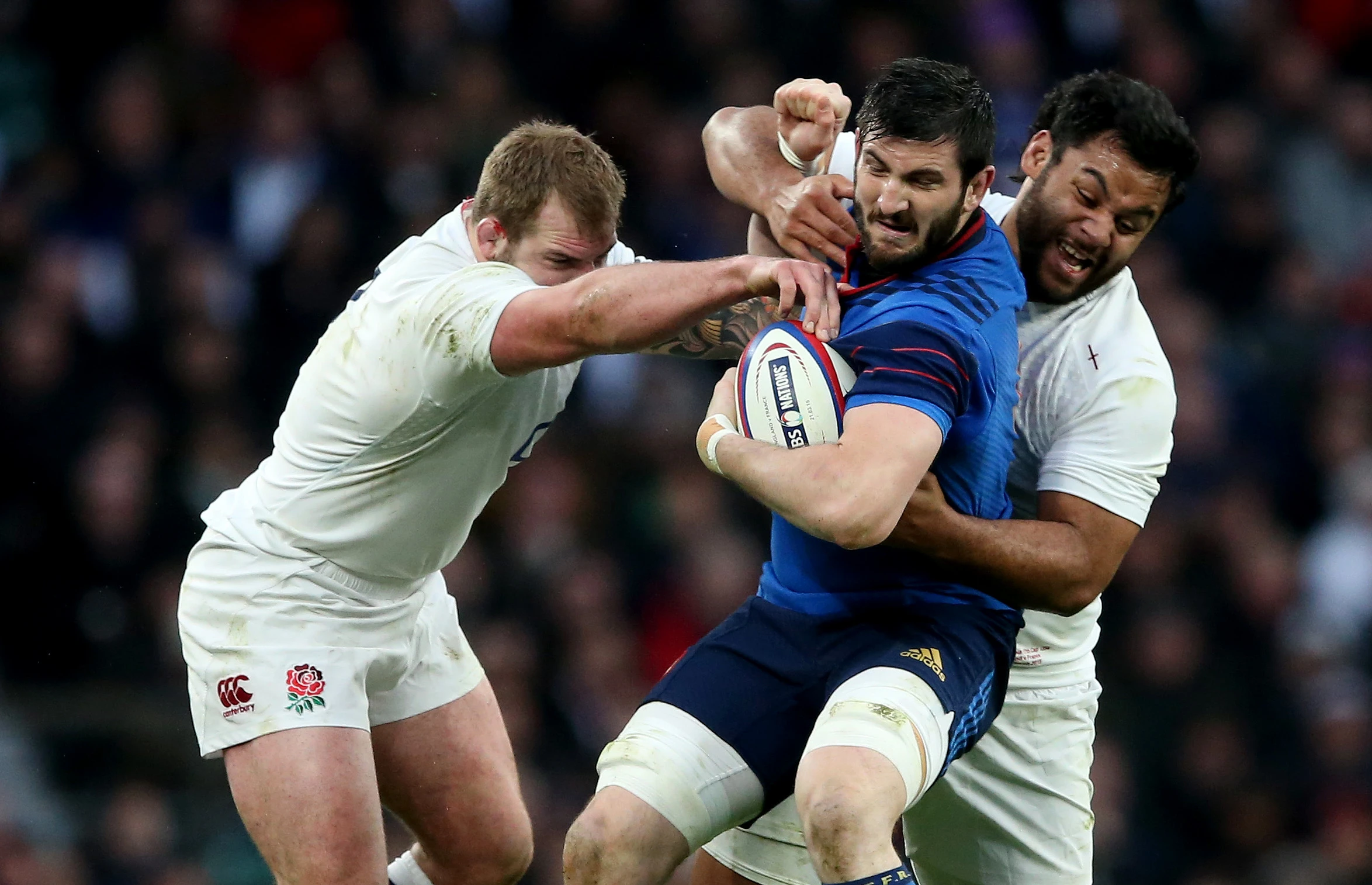 England's Joe Marler and Billy Vunipola tackle France's Loann Goujon - 2015 Six Nations.