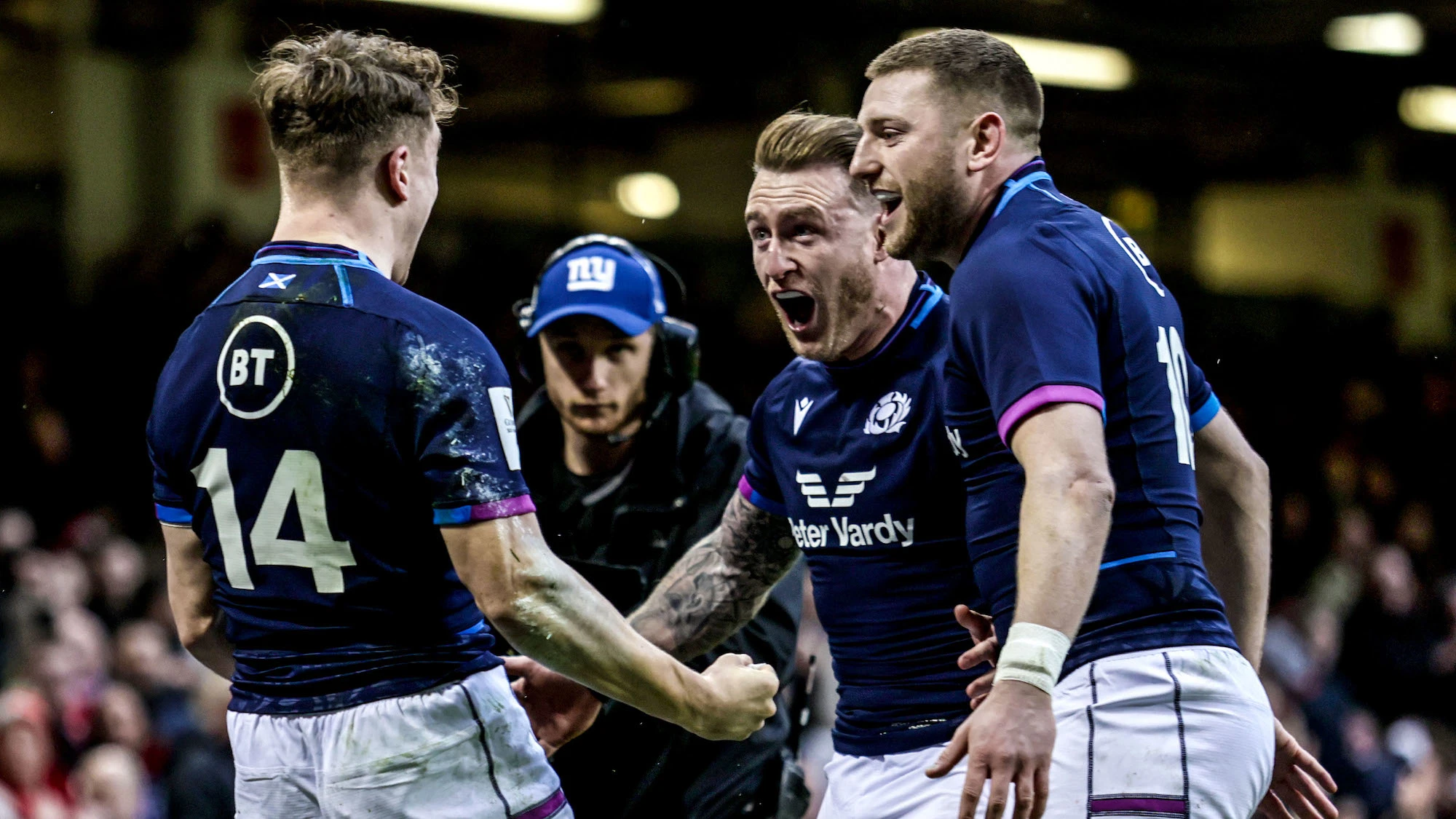 Darcy Graham celebrates scoring their first try with Stuart Hogg and Finn Russell 12/2/2022