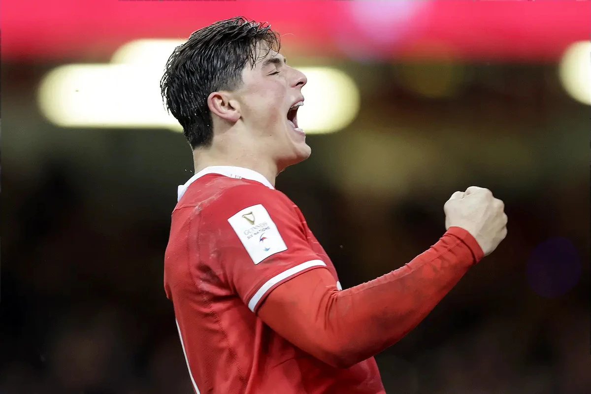 Louis Rees-Zammit celebrates scoring against England in the 2023 Championship.