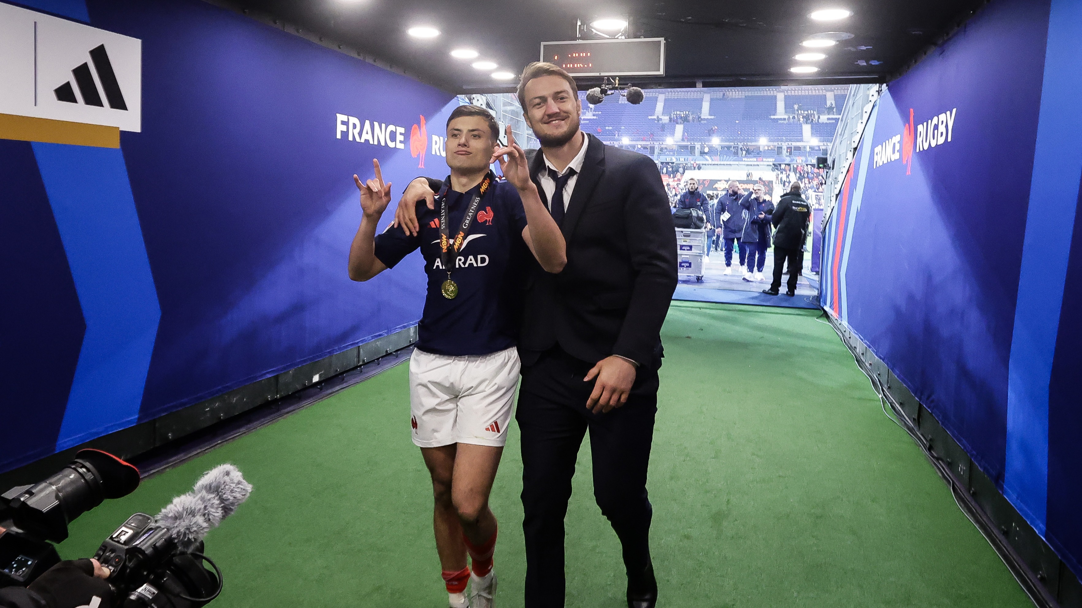Louis Bielle-Biarrey and Alexandre Roumat celebrate after beating Scotland at the Stade de France to win the 2025 Championship.