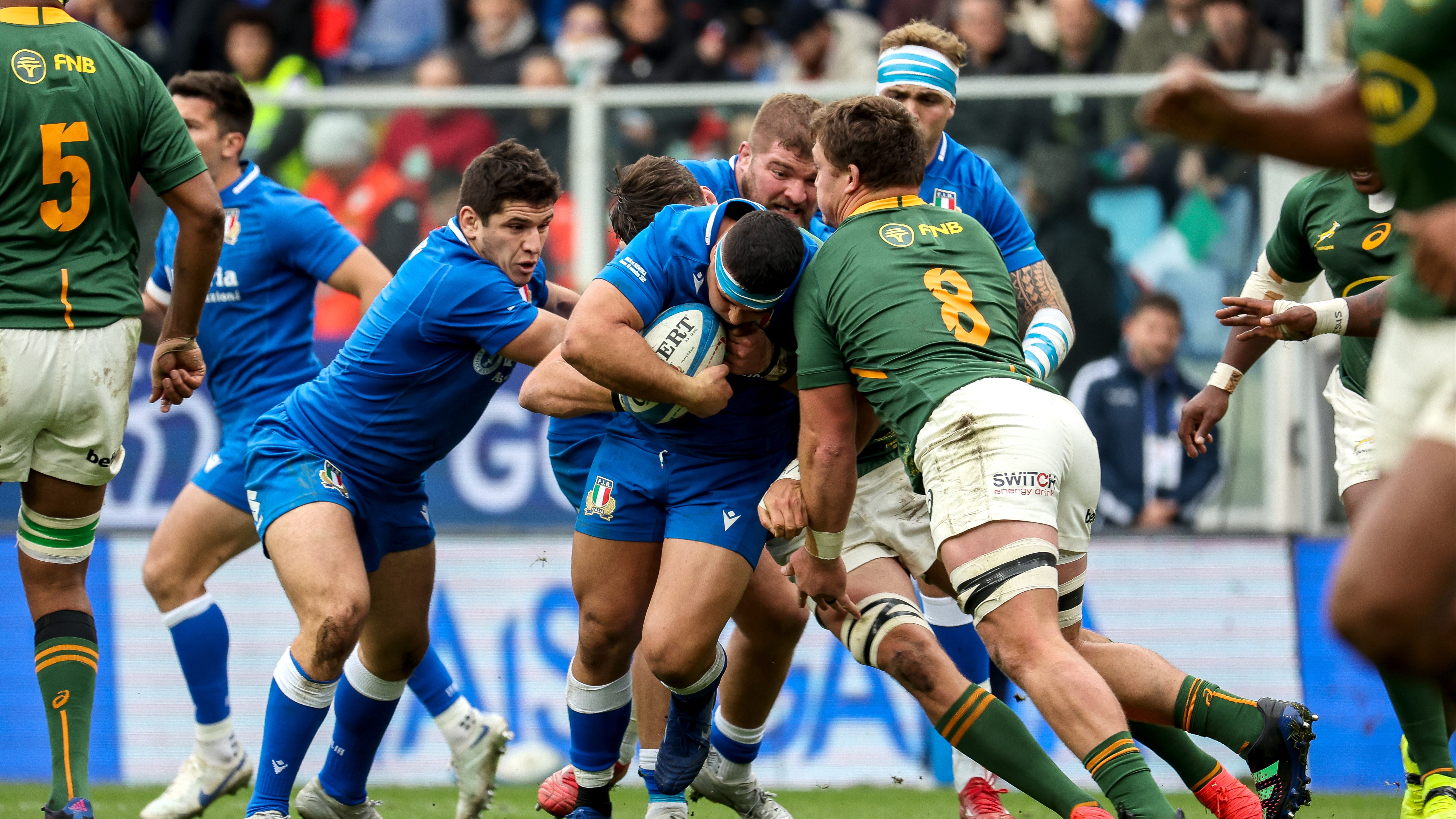 Italy's Danilo Fischetti attempts to power through the tackle of South Africa's Jasper Wiese in their 2022 encounter.