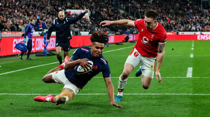 2025 Guinness Six Nations Championship Round 1, Stade de France, Paris, France 31/1/2025
France vs Wales
France's Théo Attissogbe scores their first try despite Josh Adams of Wales
Mandatory Credit ©INPHO/Manuel Blondeau