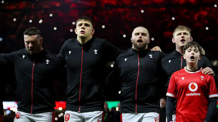 Wales players sing the anthem prior to facing England, 2025