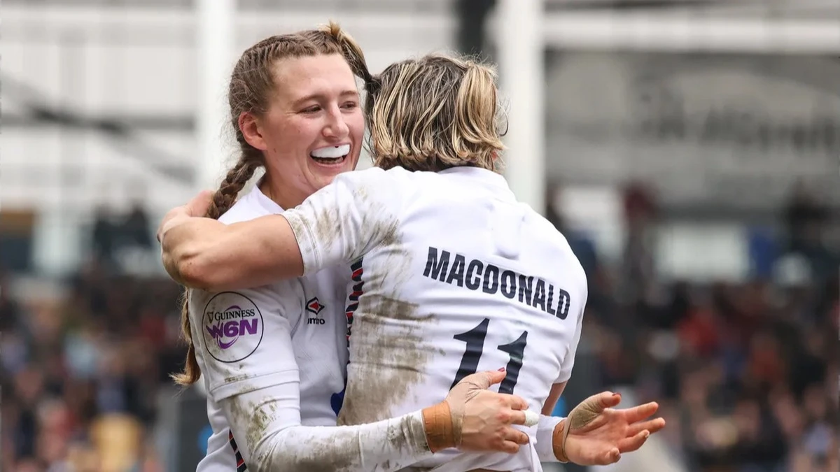 Emma Sing congratulates Claudia MacDonald on scoring a try against Italy during the 2025 Guinness Women's Six Nations