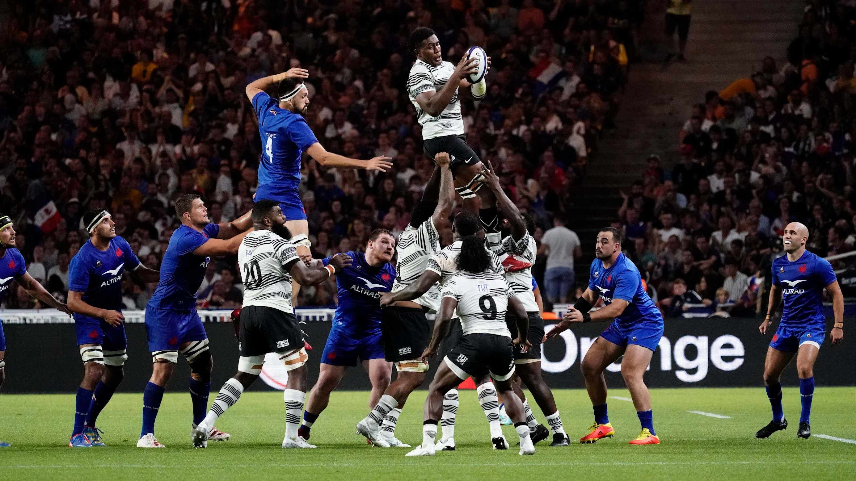 Te Ahiwaru Cirikidaveta of Fiji takes the line-out ball ahead of Florian Verhaeghe of France in 2023.