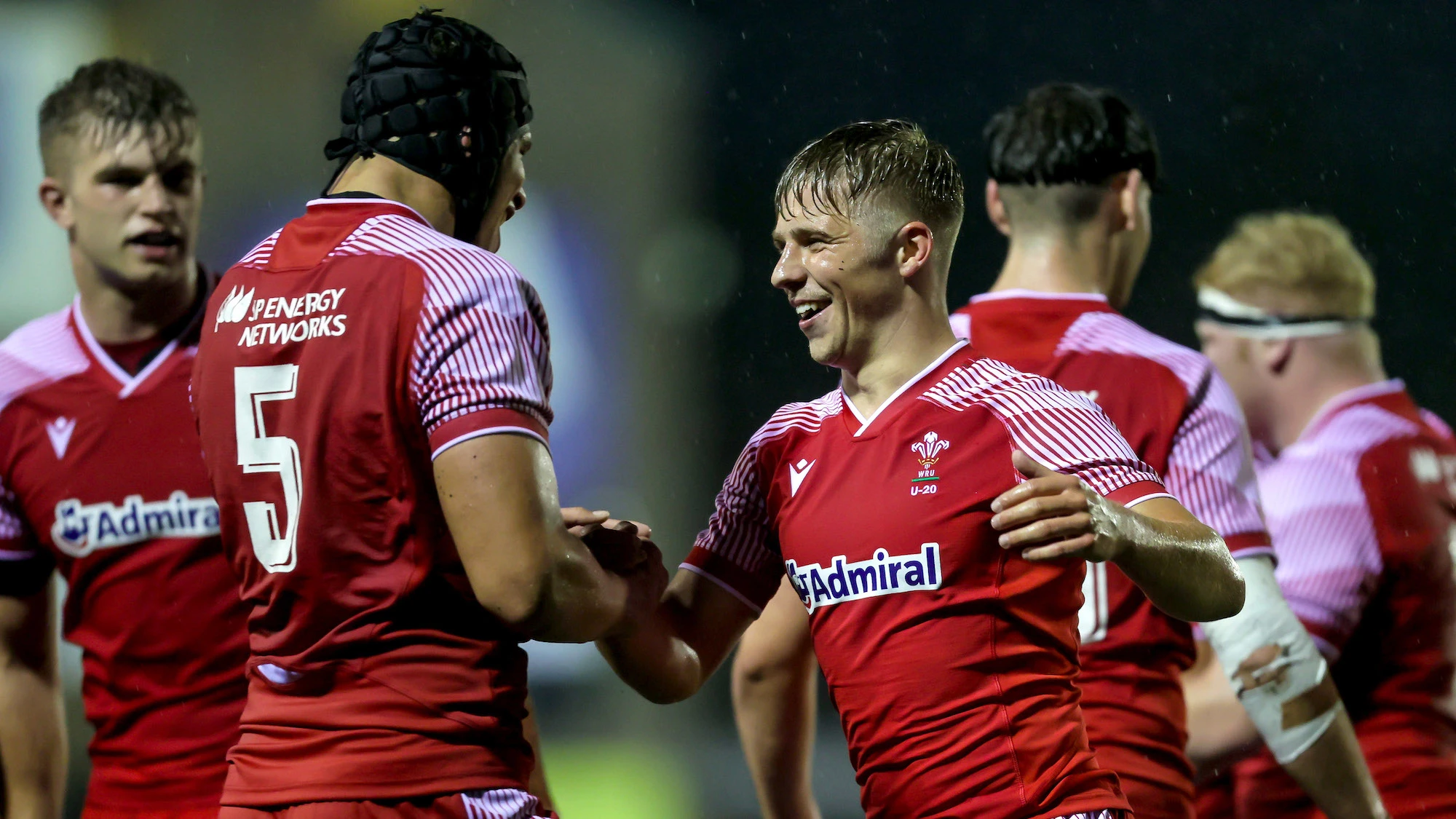 Dafydd Jenkins celebrates after the game with Ethan Lloyd 19/6/2021