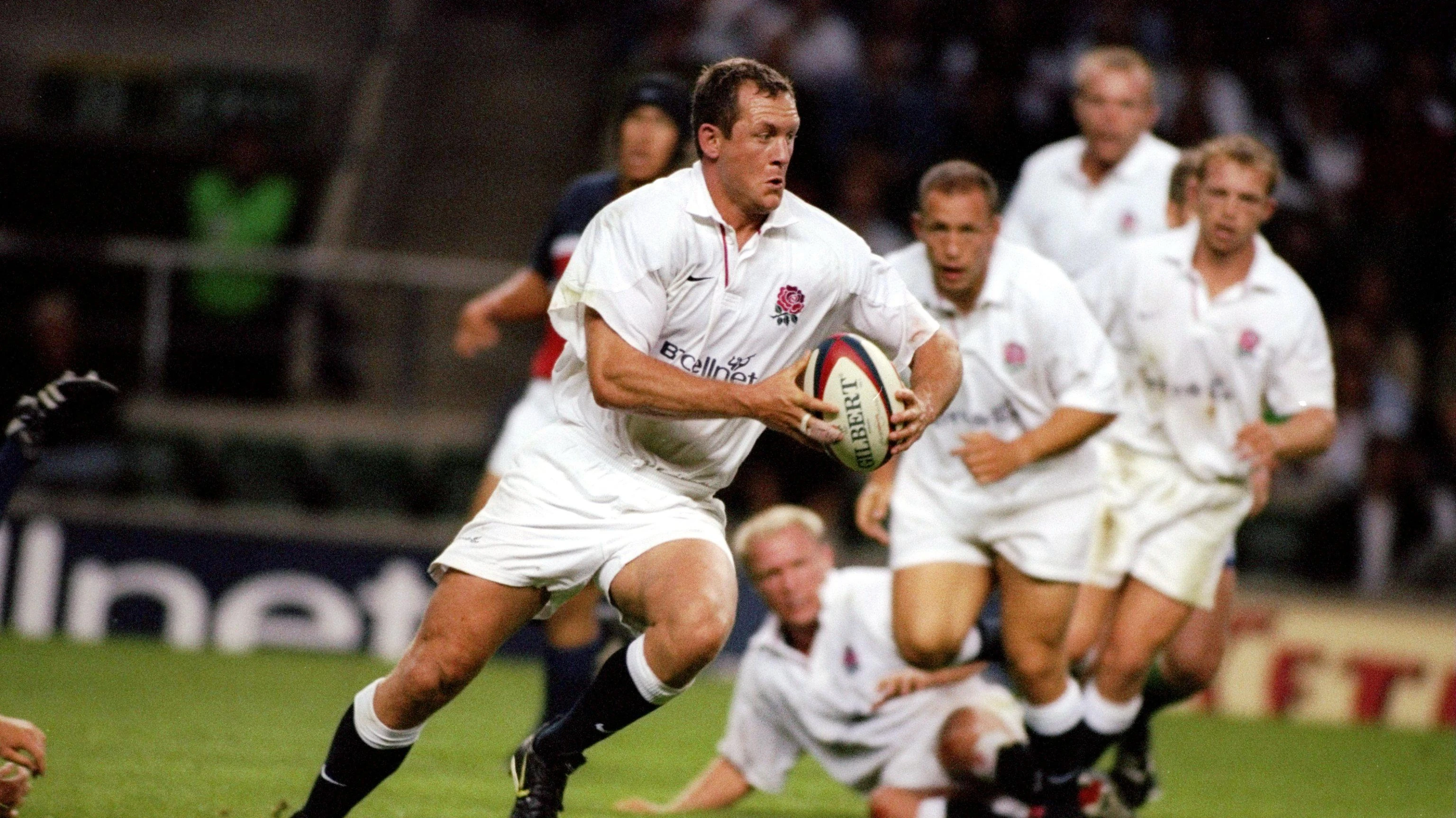 Richard Hill carries for England in 1999.