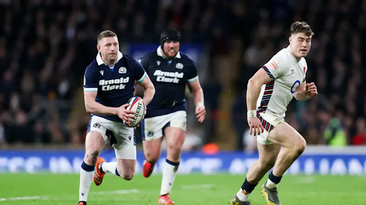 Finn Russell of Scotland and Tommy Freeman of England during the 2025 Calcutta Cup clash.