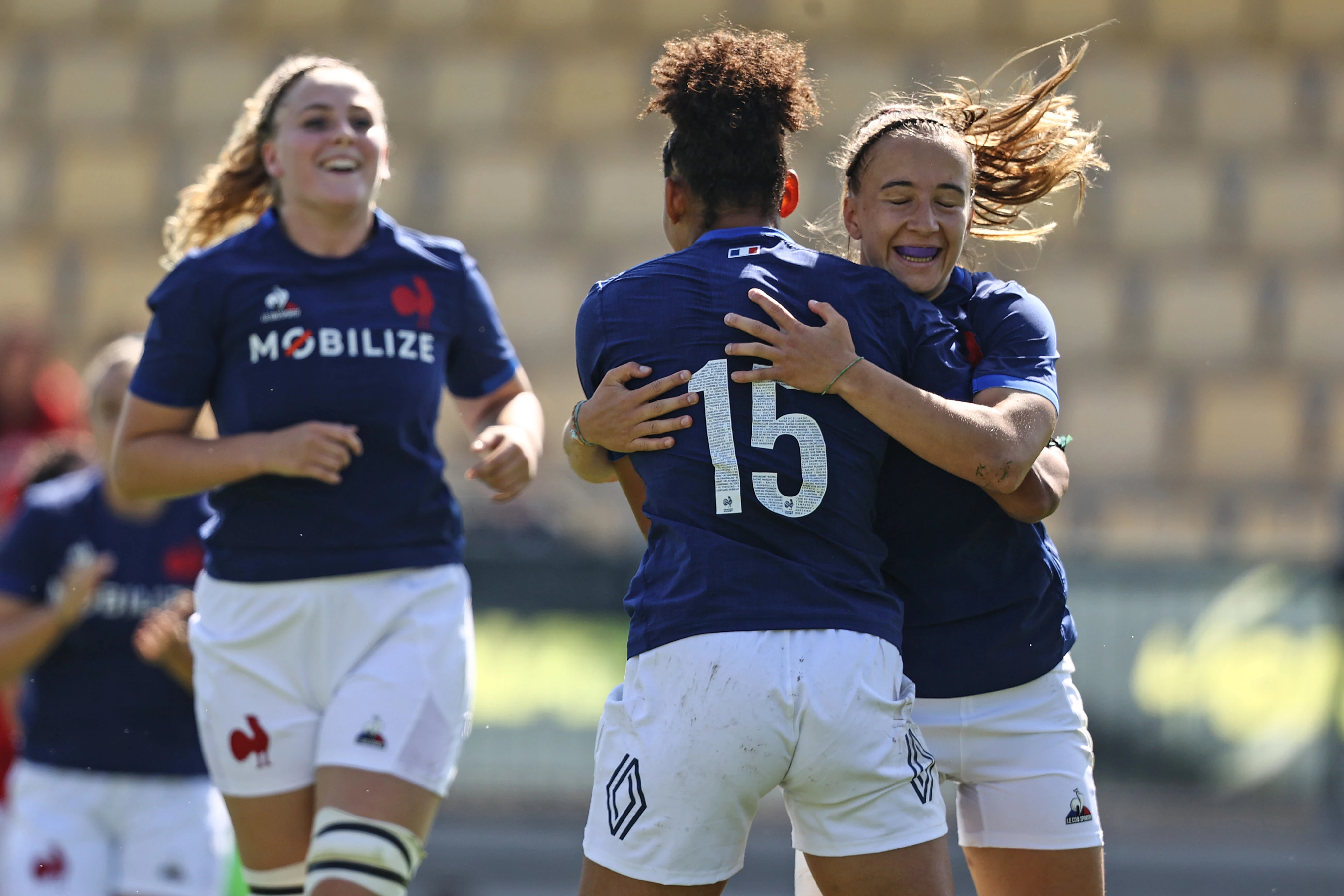 France's Kelly Arbey celebrates with Mae Levy