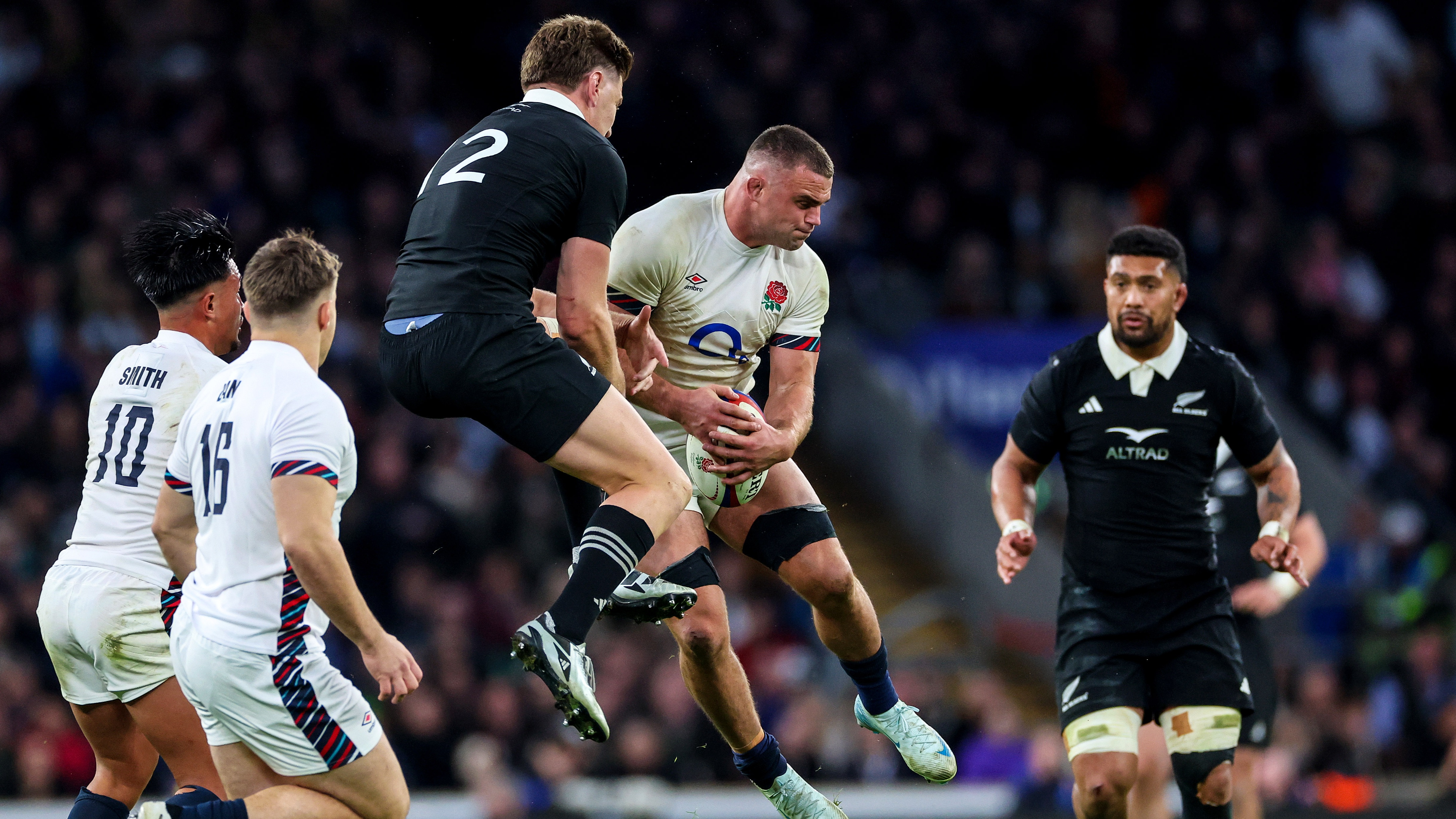 Jordie Barrett and Ben Earl compete for a high ball during the 2024 England v New Zealand encounter.