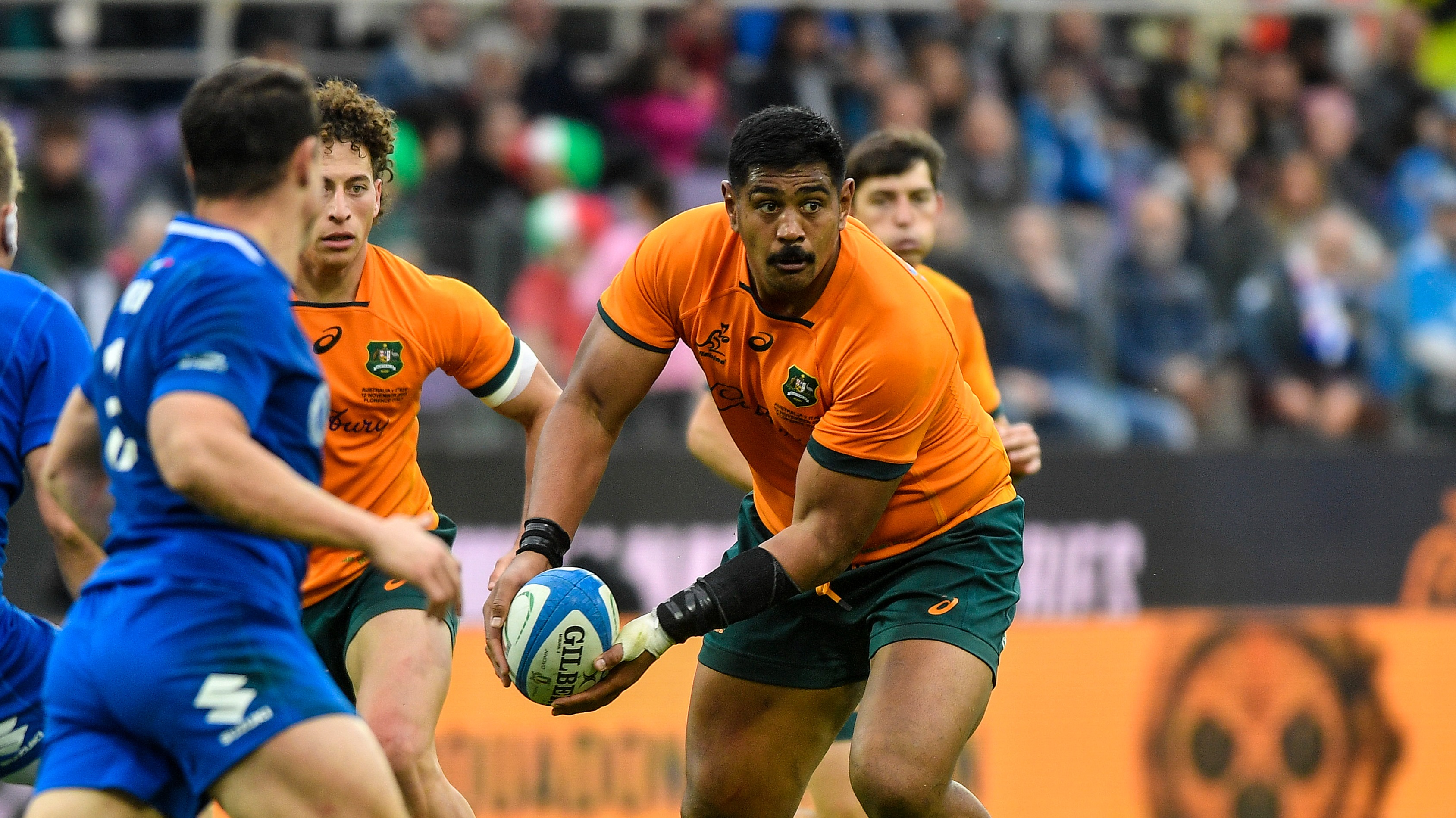 Australia's Will Skelton looks to get the ball away against Italy in 2022.