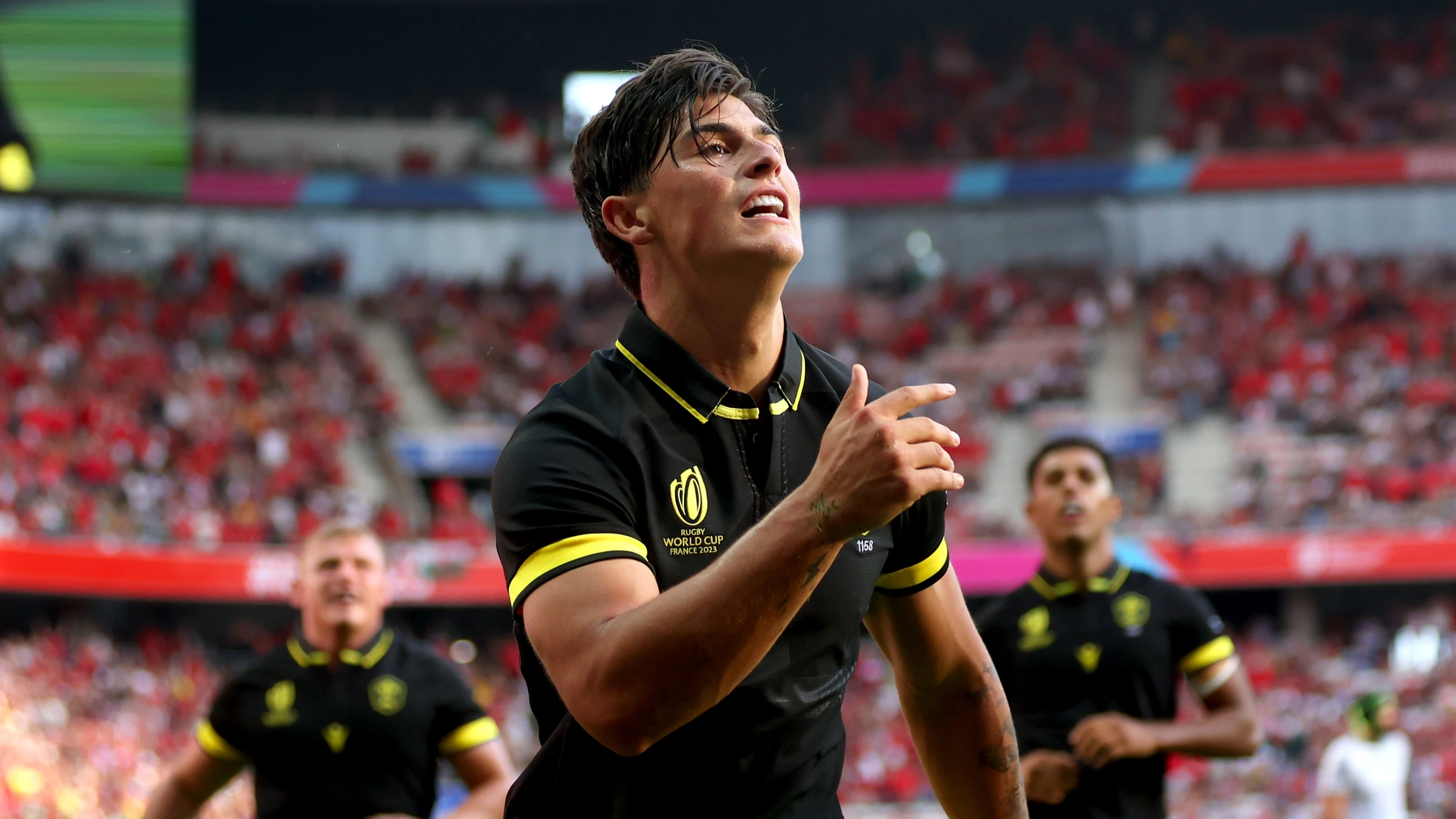 Louis Rees-Zammit celebrates scoring for Wales during the 2023 World Cup.