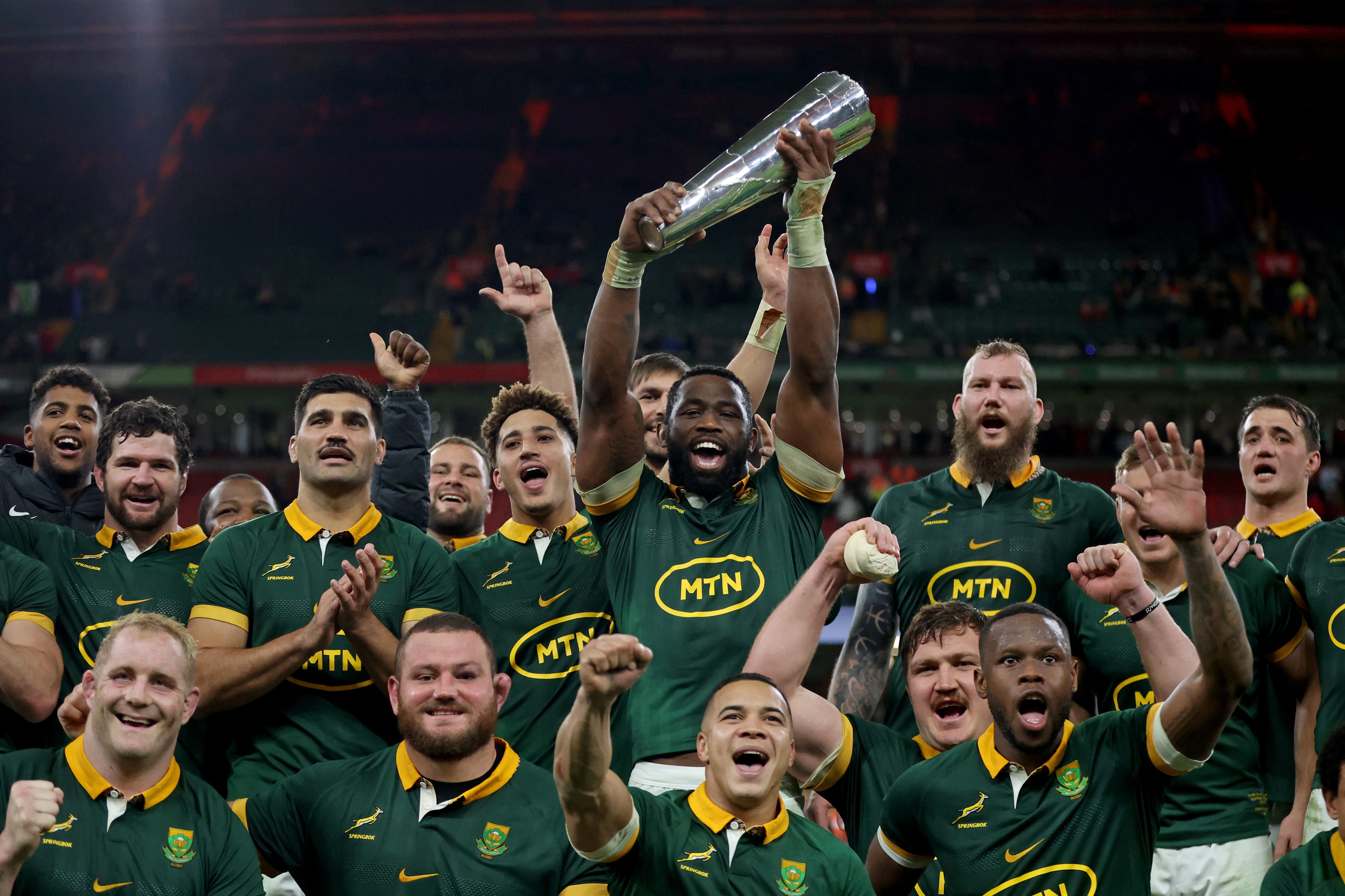 south africa celebrate with trophy after beating wales