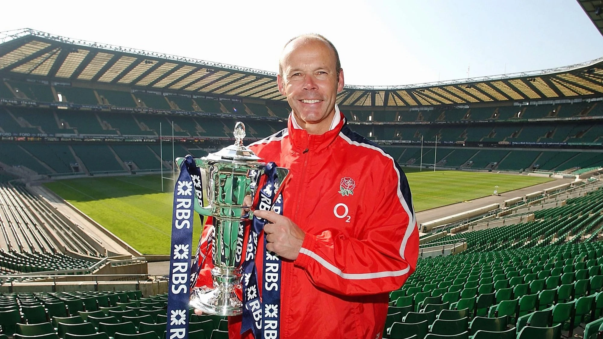 Clive Woodward holds the 2003 Six Nations trophy aloft.