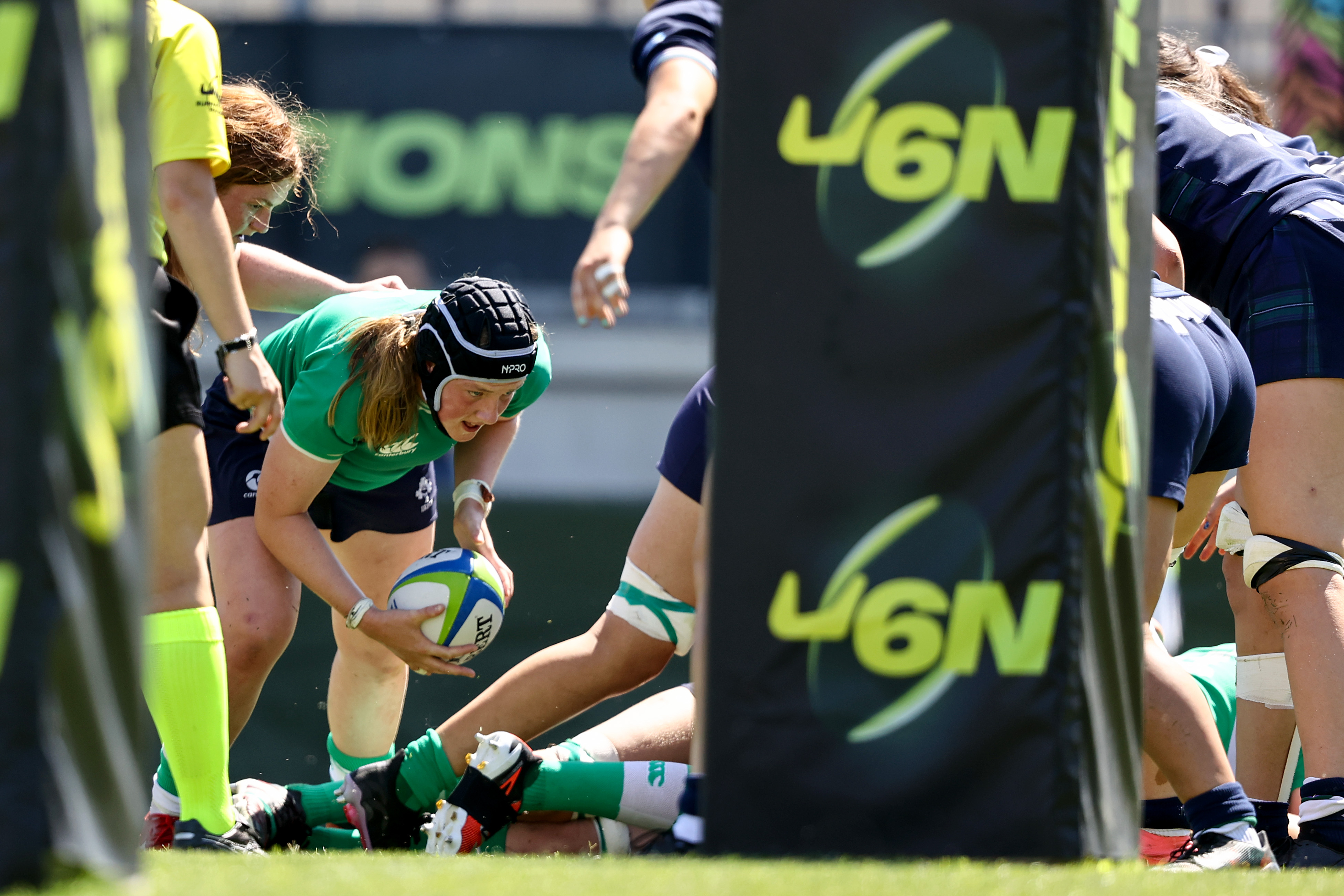 Beth Buttimer crosses for her second of three tries against Scotland