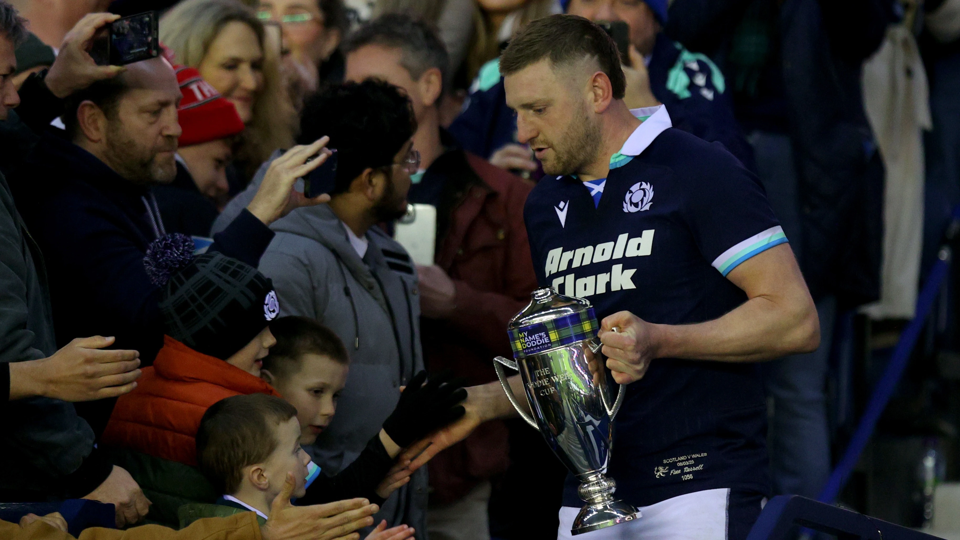 Finn Russell with the Doddie Weir Cup - 2025