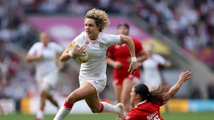 Ellie Kildunne of England races clear to score her team's first try during the Women's Rugby World Cup 2025 Final match between Canada and England at Allianz Stadium.