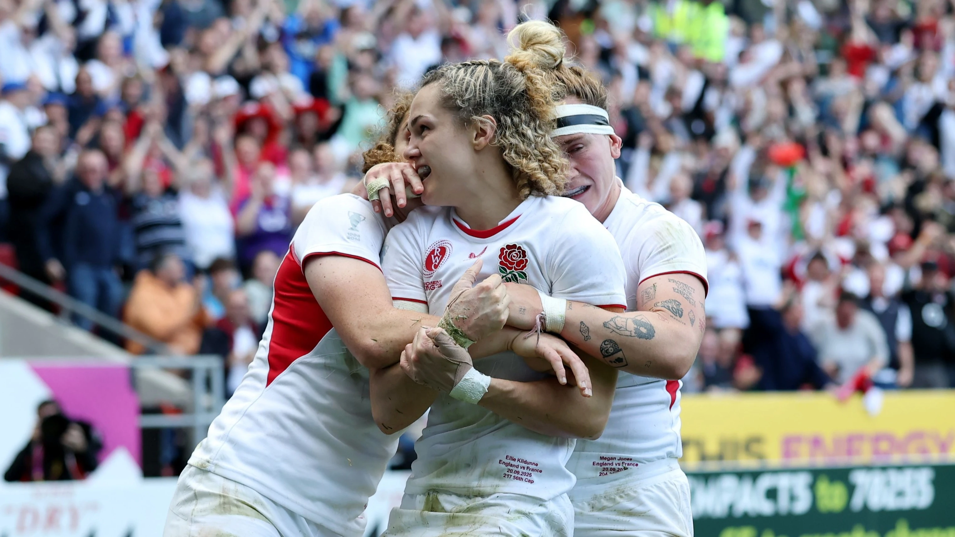  Ellie Kildunne of England celebrates scoring her team's fourth try with team mates Megan Jones and Abby Dow during the Women's Rugby World Cup 2025 Semi Final match between France and England