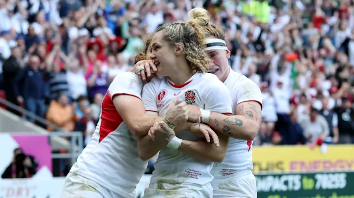 Ellie Kildunne of England celebrates scoring her team's fourth try with team mates Megan Jones and Abby Dow during the Women's Rugby World Cup 2025 Semi Final match between France and England
